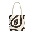 Black cream abstract tote bag with beige handles on a white background