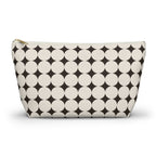 Black Cream Geometric makeup bag with T-bottom and gold zipper pull, front view