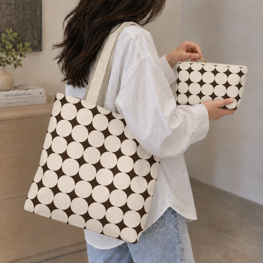 Woman carrying the matching tote bag and Black Cream Geometric makeup bag