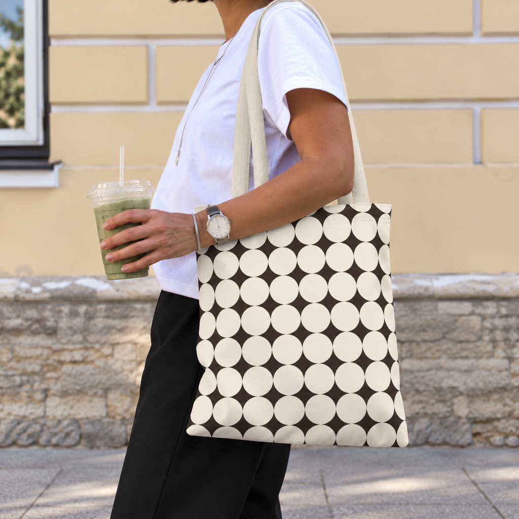 Woman walking with the Black Cream Geometric tote bag on her shoulder