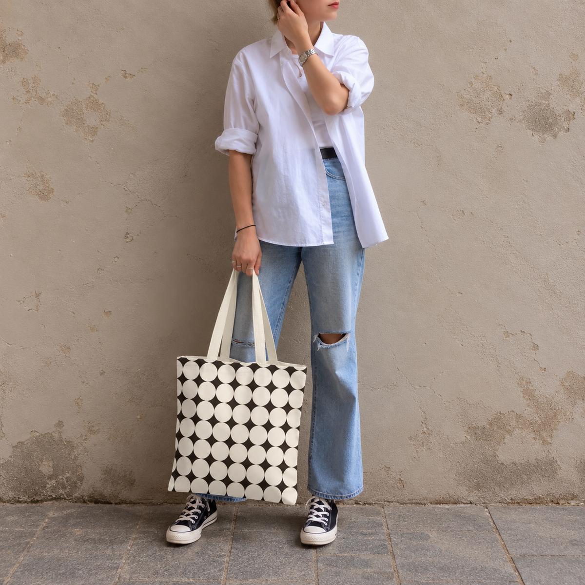 Full-length model photo with the Black Cream Geometric tote bag against a wall