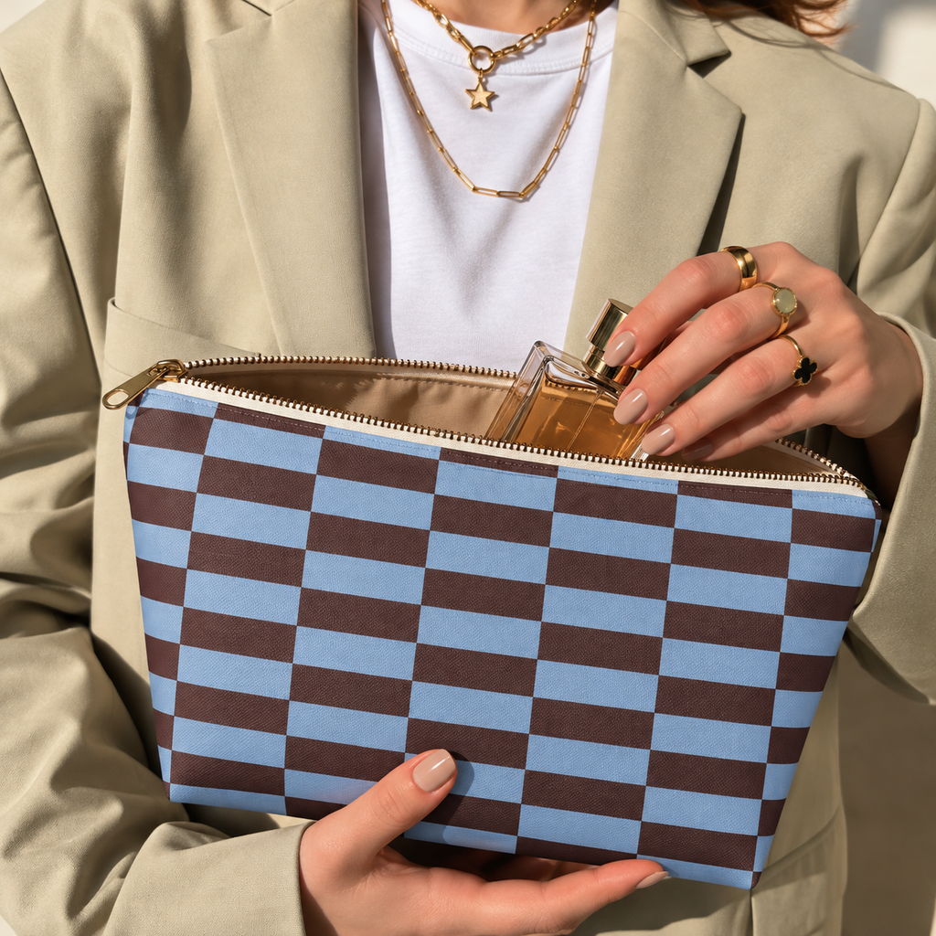 Hands holding the open blue brown brick makeup bag