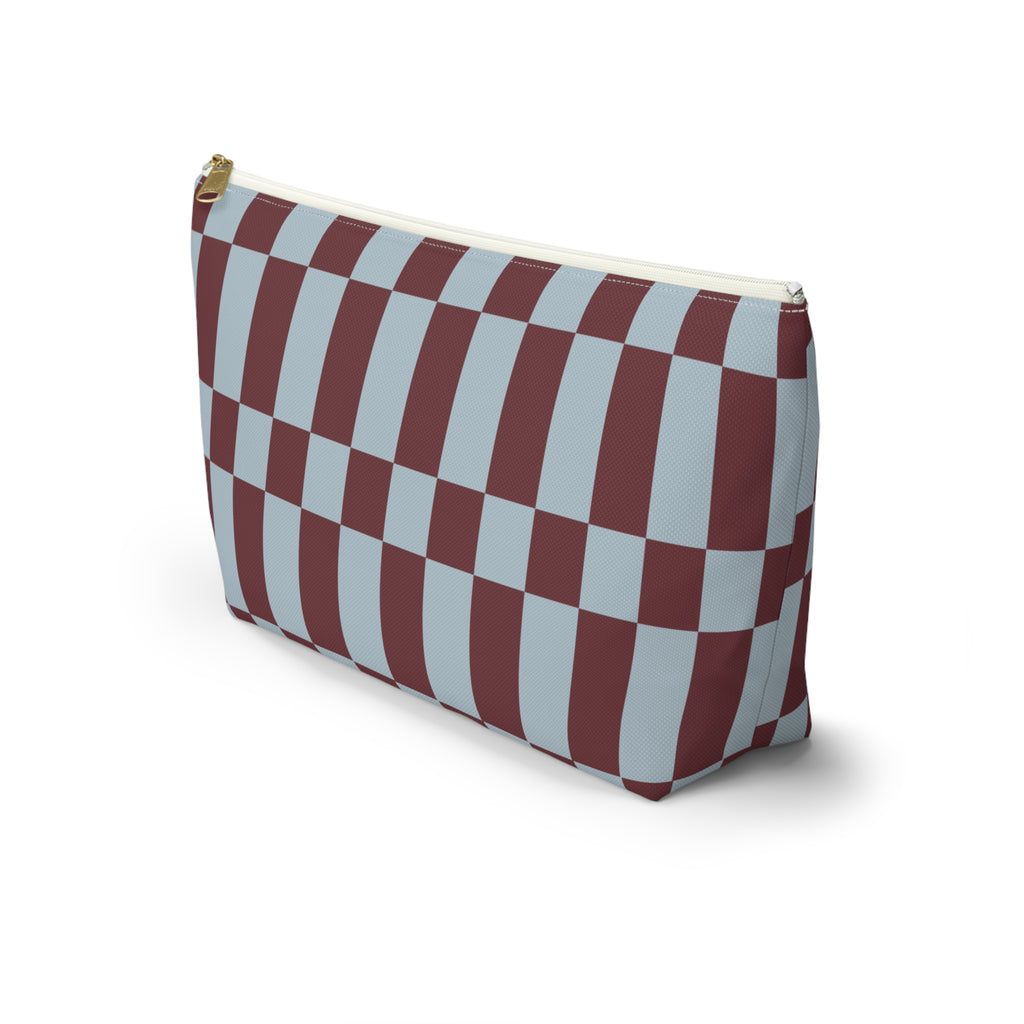 Side view of the blue burgundy checkerboard makeup bag standing on a white background