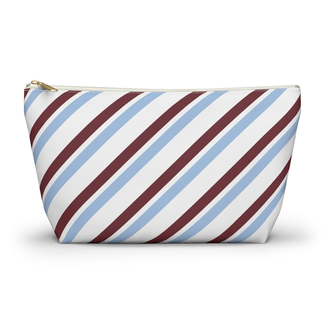 Blue burgundy diagonal striped makeup bag with T-bottom and gold zipper pull, front view