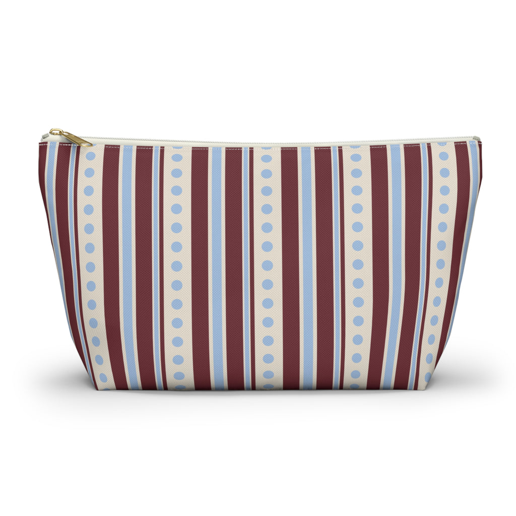 Blue burgundy dot striped makeup bag with T-bottom and gold zipper pull, front view