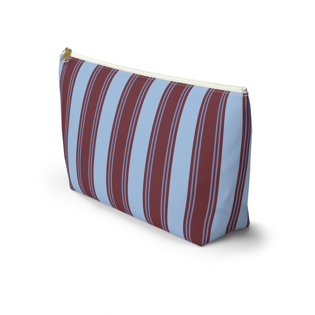 Side view of the blue burgundy striped makeup bag with T-bottom