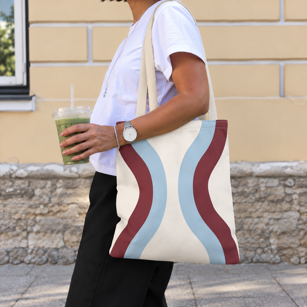 Side view of a model carrying the wavy tote bag on her shoulder