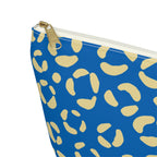 Close-up of the gold zipper pull and cream leopard spots on the makeup bag