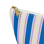 Close-up of the cobalt blue and cream stripes and gold zipper pull on the makeup bag