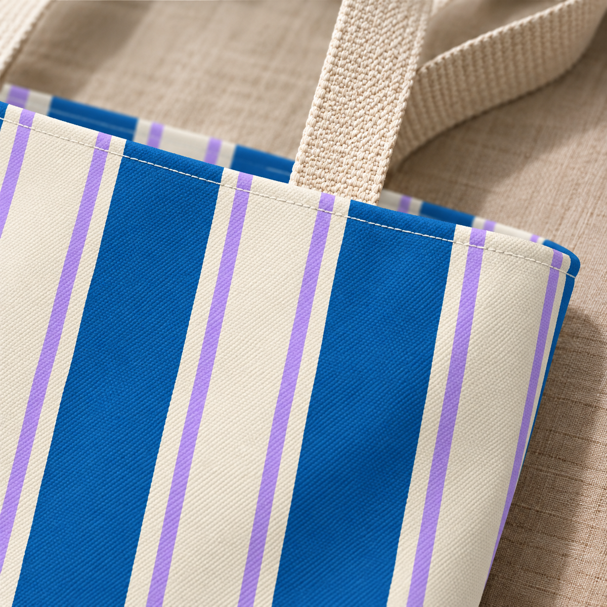 Close-up of the cobalt blue and cream stripes and the handle of the striped tote bag