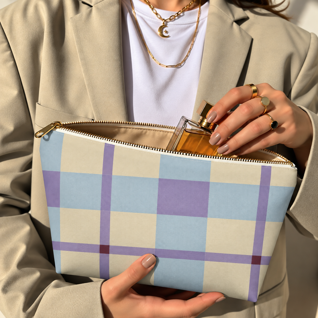 Model in a beige blazer taking a product out of the open blue lilac cream plaid makeup bag