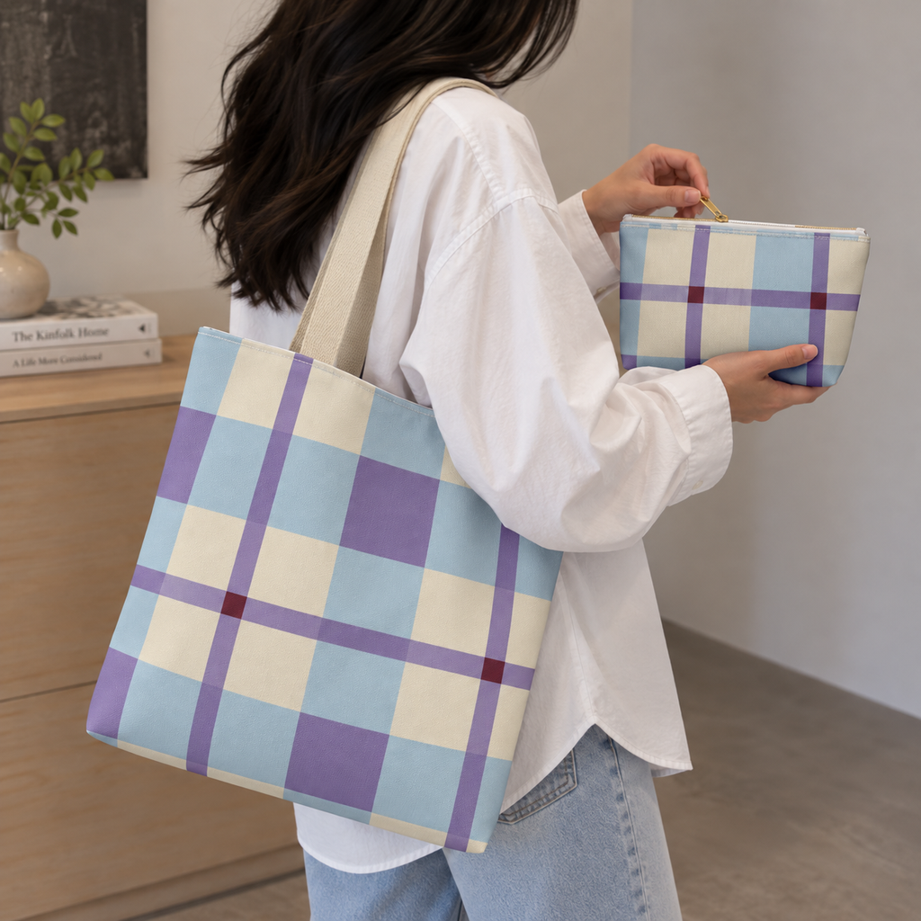 Woman carrying the blue lilac cream plaid tote bag while holding the matching makeup bag