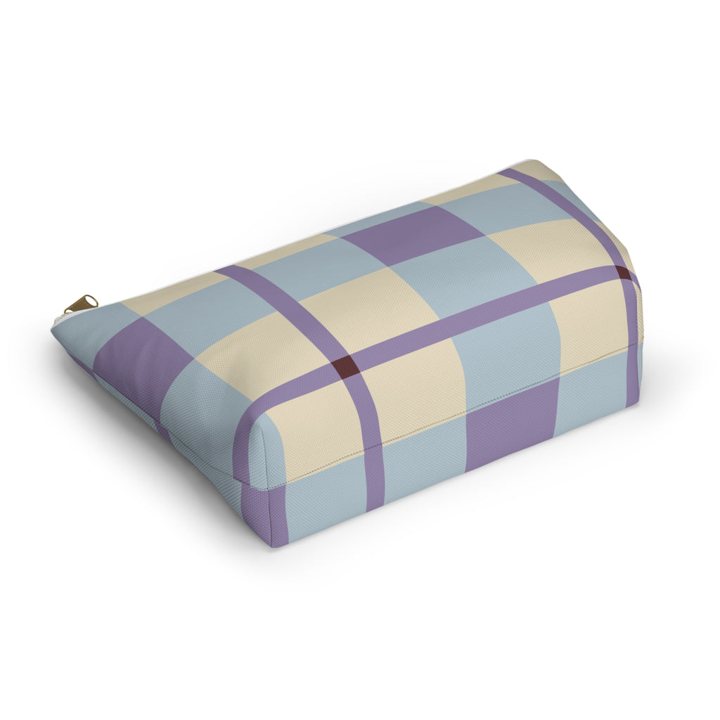 Blue lilac cream plaid makeup bag lying on its side in an angled view