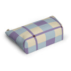 Blue lilac cream plaid makeup bag lying on its side in an angled view
