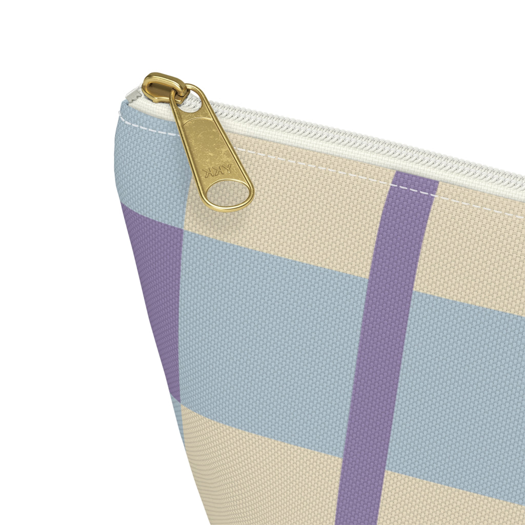 Close-up of the gold zipper pull on the blue lilac cream plaid makeup bag