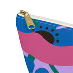 Close-up of the gold zipper pull on the blue pink poppy floral makeup bag