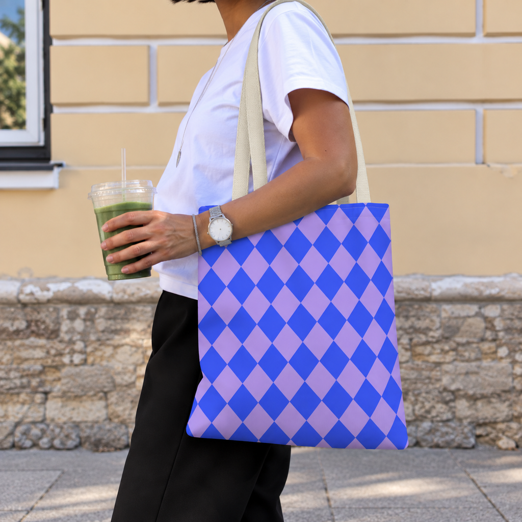 Woman walking with the blue purple diamond checkered tote bag on her shoulder