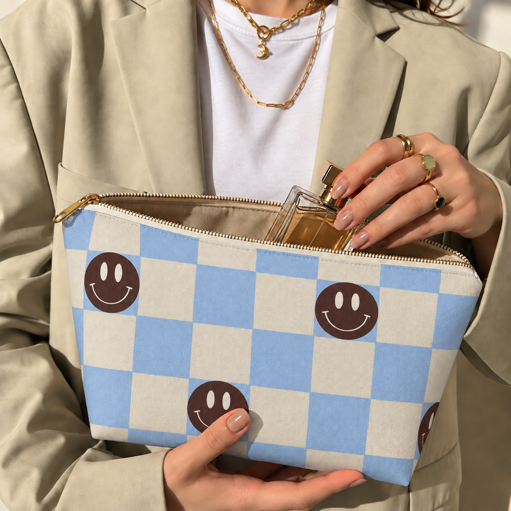 Woman opening the blue checkered makeup bag with her hands to take out a product