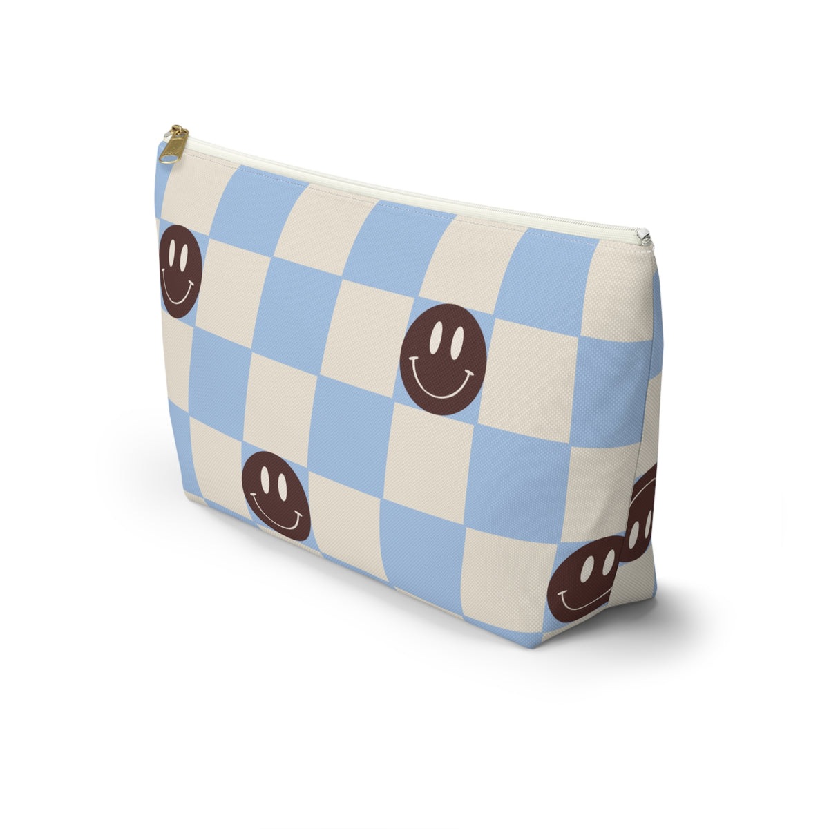Side view of the blue smiley face checkered makeup bag standing upright