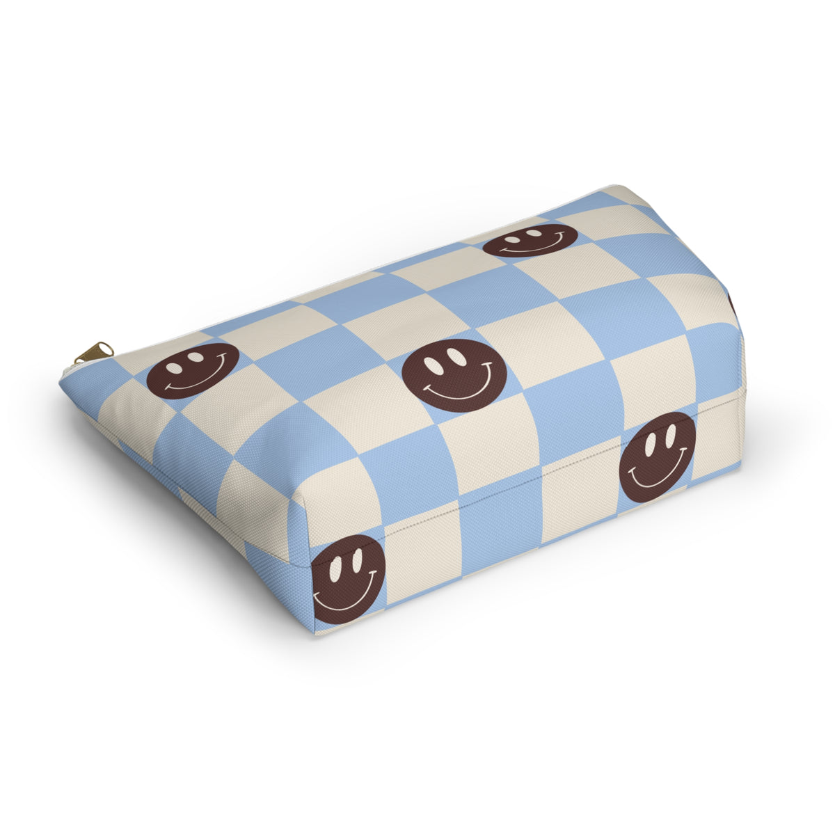 Blue and cream checkered cosmetic bag with smiley faces lying at an angle