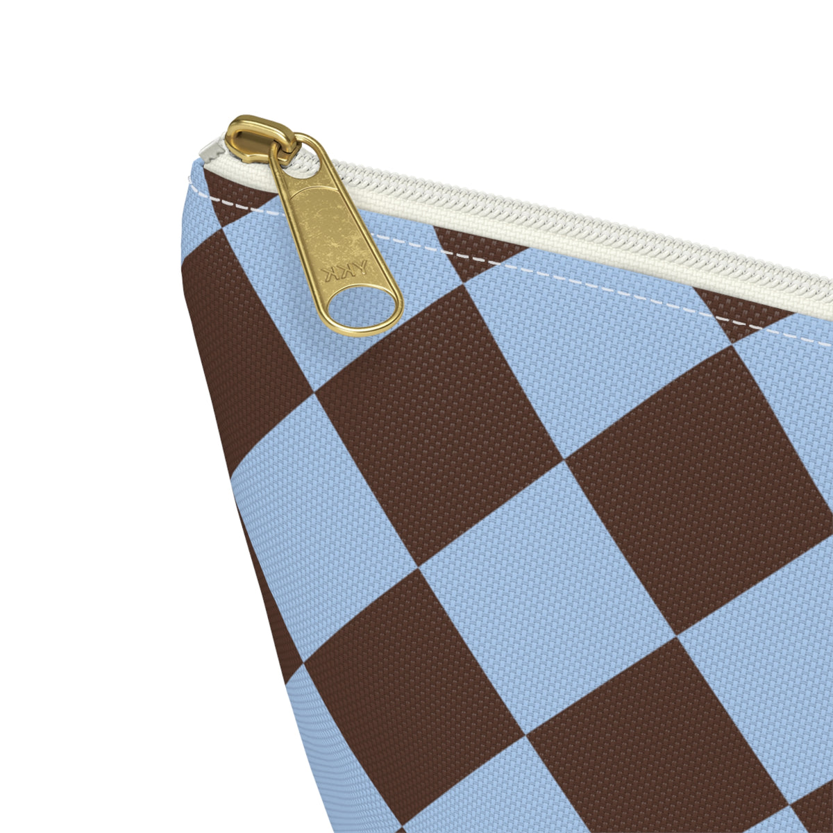 Close-up of the gold zipper pull and brown sky blue diamonds on the makeup bag
