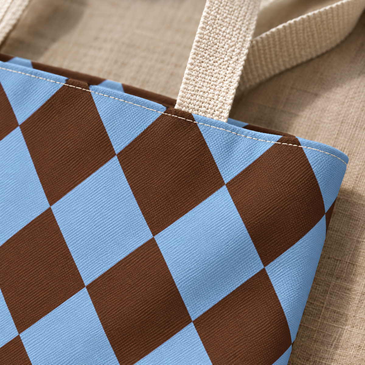 Close-up of brown and sky blue diamonds and the tote bag handle