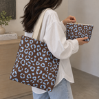 Brown blue leopard print tote bag carried on the shoulder with the matching makeup bag