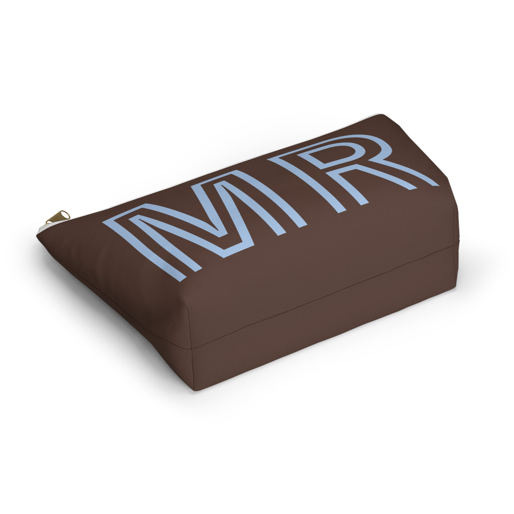 Brown blue monogram cosmetic bag lying at an angle