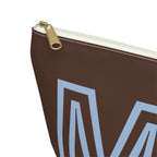 Close-up of the gold zipper pull on the brown personalized makeup bag