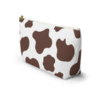 Side view of the brown cow print makeup bag standing upright