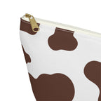 Close-up of the gold zipper pull on the brown cow print makeup bag