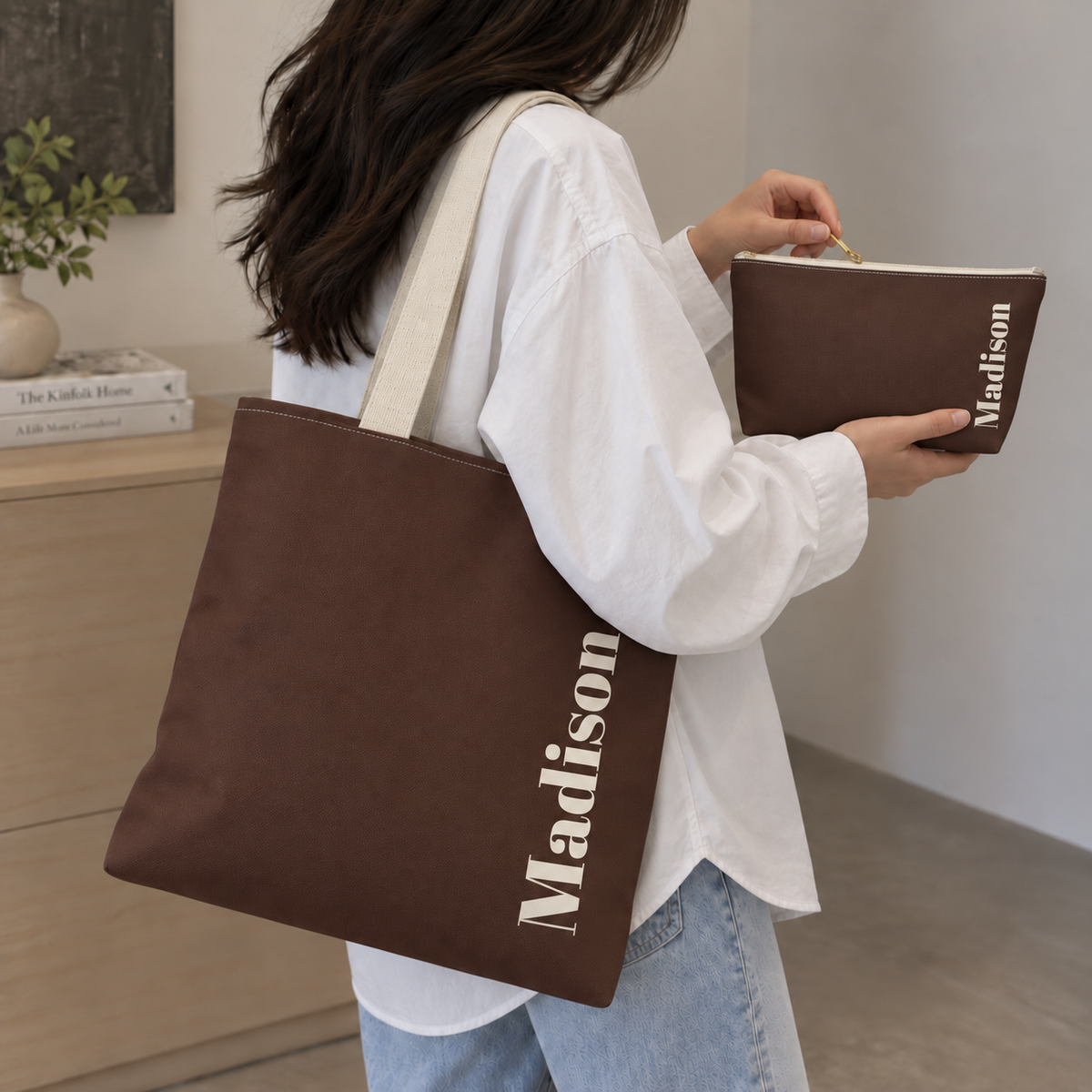 Woman carrying the Brown Cream Name personalized tote bag on her shoulder with the matching makeup bag