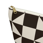 Close-up of the gold zipper pull and brown triangle print on the makeup bag