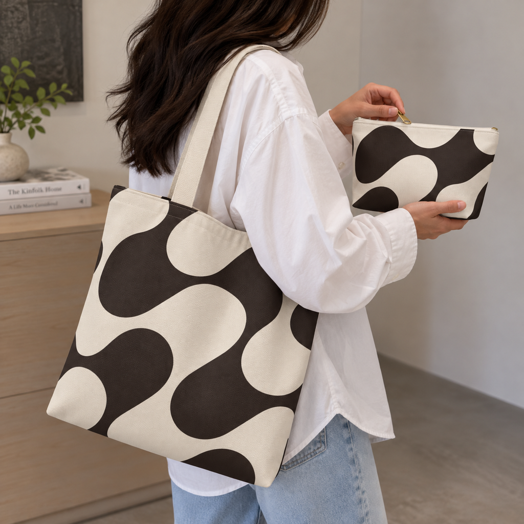 Woman carrying the brown wave tote bag and holding the matching makeup bag