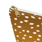 Close-up of the gold zipper pull on the Brown Fawn Spotted makeup bag