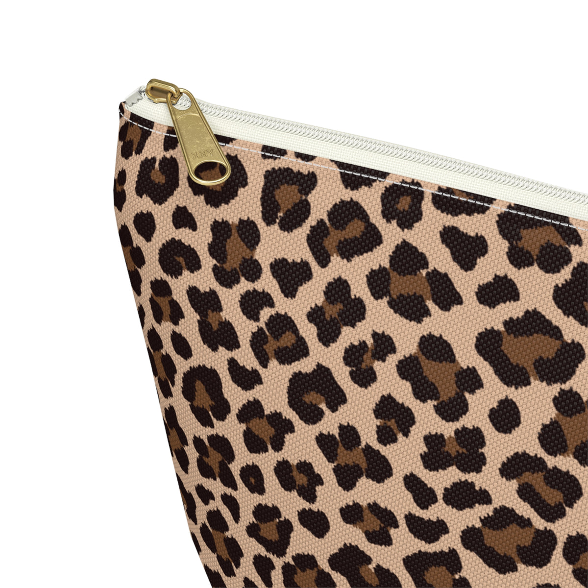 Close-up of the gold zipper pull on the brown leopard print makeup bag
