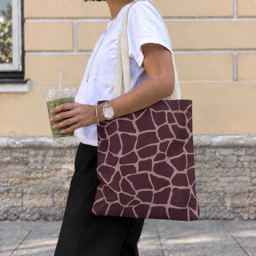 Woman with a brown giraffe print tote bag with pink lines over her shoulder