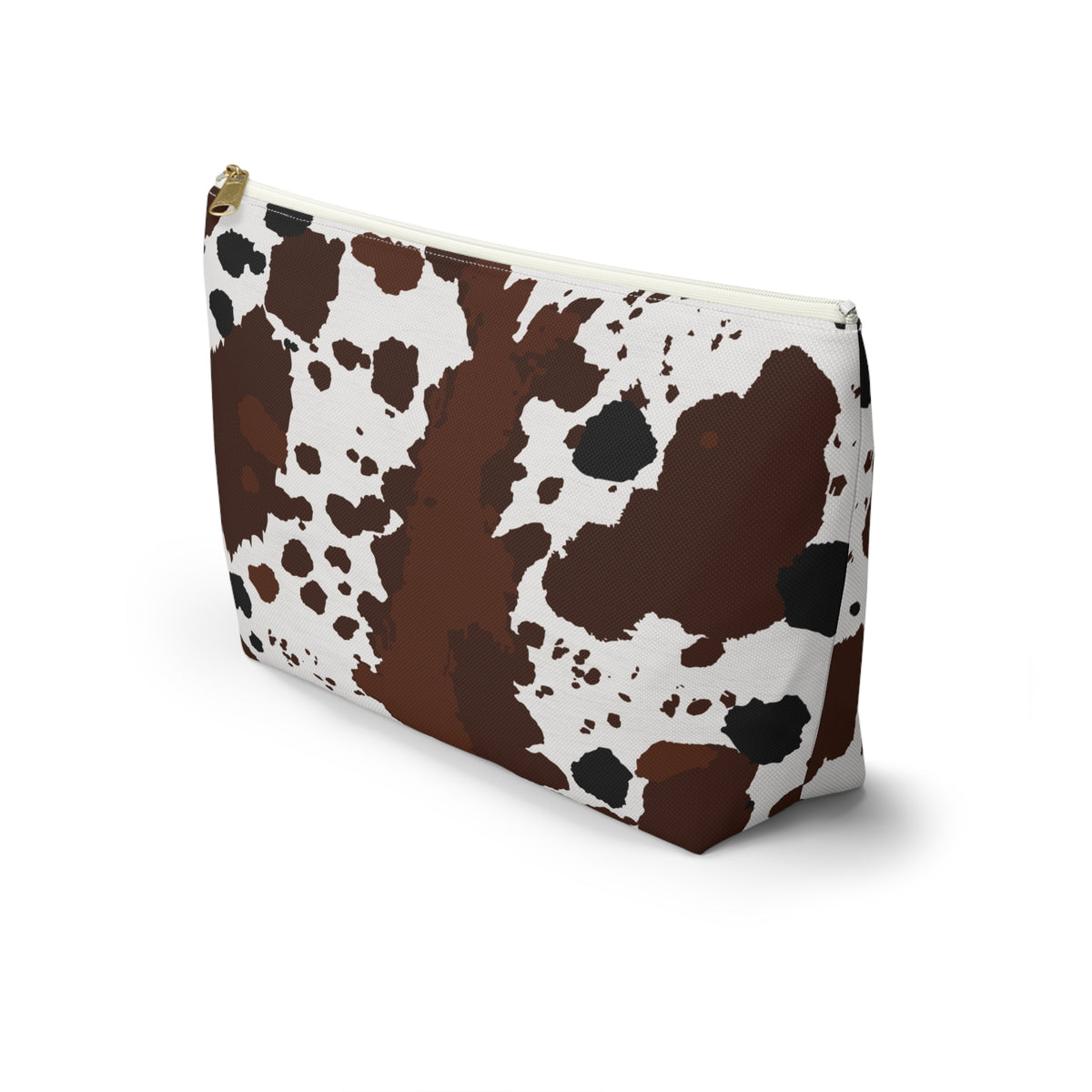 Side view of the cow print makeup bag in brown and white