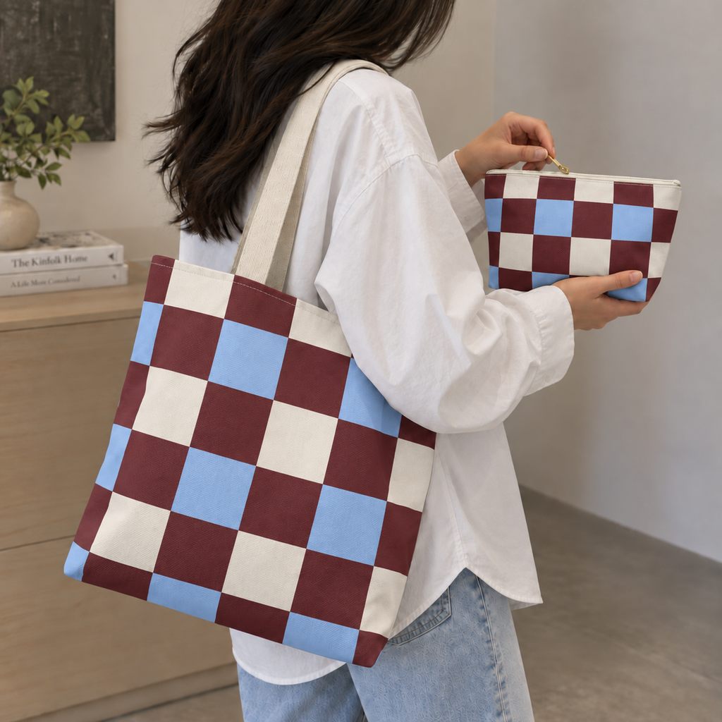 Woman carrying the burgundy blue cream checkered tote bag with the matching makeup bag in her hand