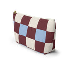 Side view of the burgundy blue cream checkered makeup bag standing on a white background