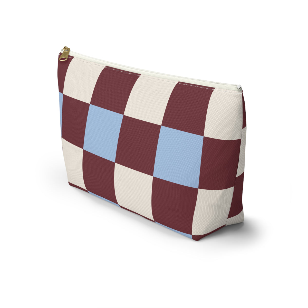 Side view of the burgundy blue cream checkered makeup bag standing on a white background