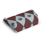 Diamond makeup bag lying on its side showing the burgundy and blue harlequin print