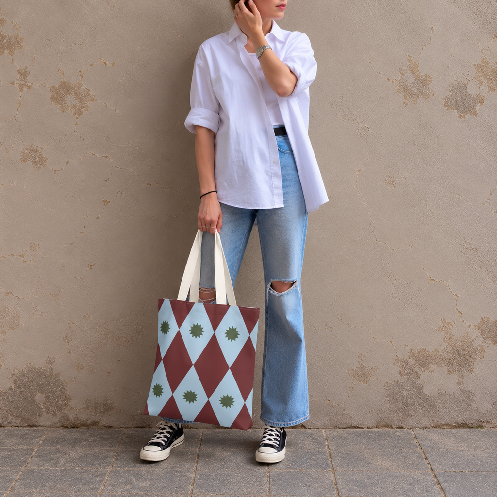 Model in jeans standing with the burgundy blue diamond tote bag in her hand