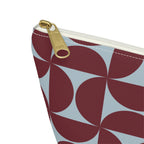 Close-up of the gold zipper pull and burgundy blue geometric print on the makeup bag