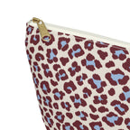 Close-up of the gold zipper pull on the burgundy blue leopard print makeup bag