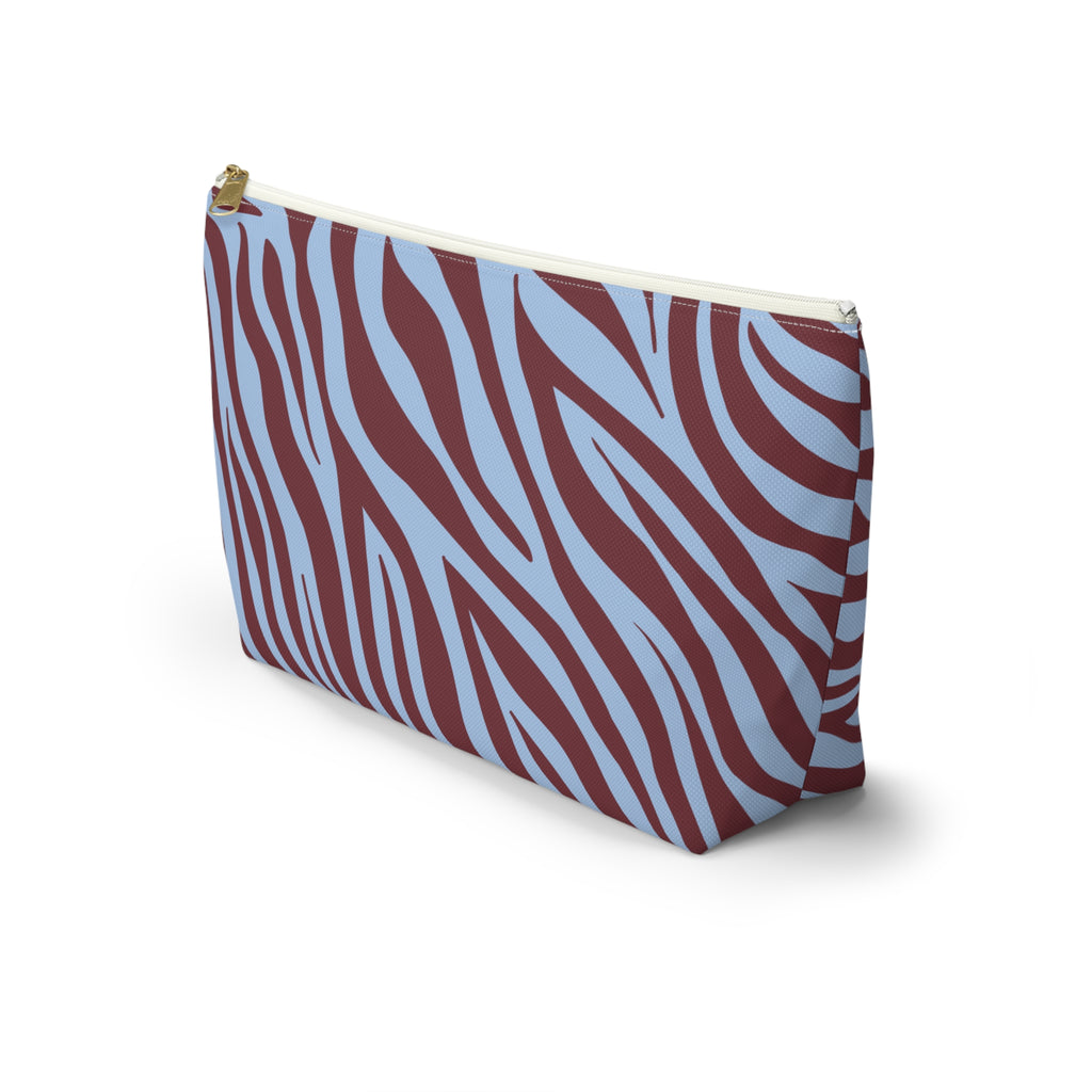 Side view of the burgundy blue zebra print makeup bag standing upright