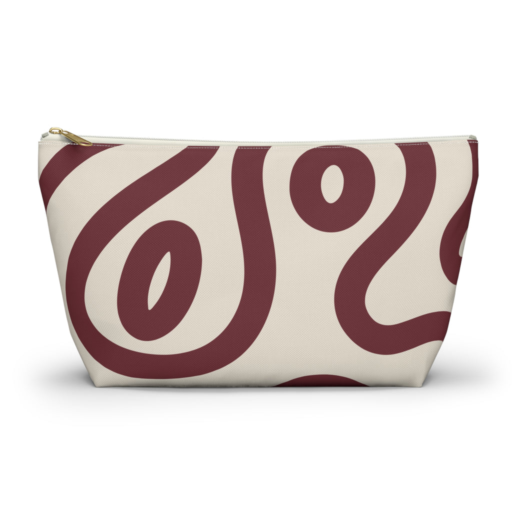 Burgundy cream abstract makeup bag with T-bottom shape seen from the front