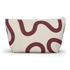 Back view of the burgundy cream abstract makeup bag
