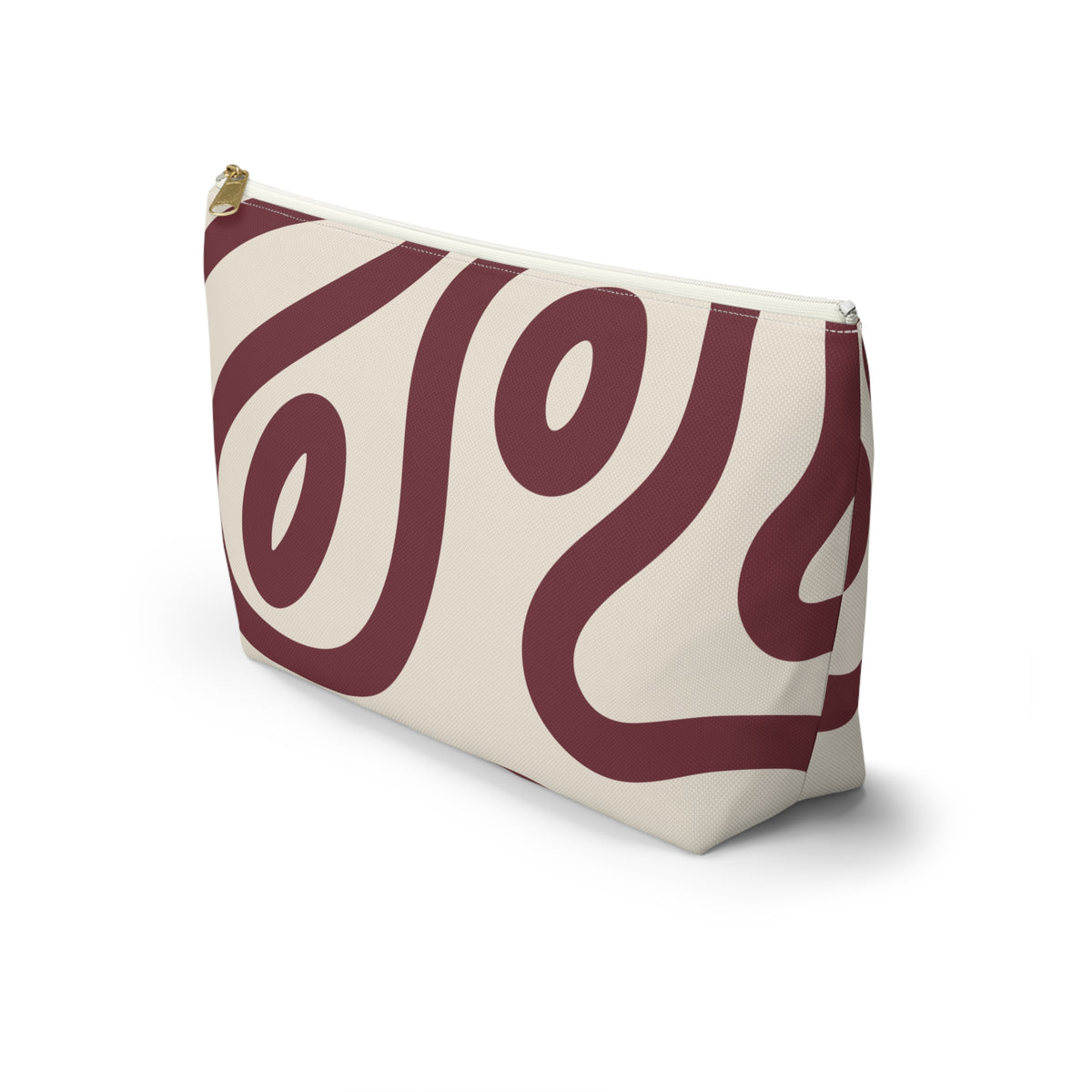 Side view of the burgundy cream abstract makeup bag