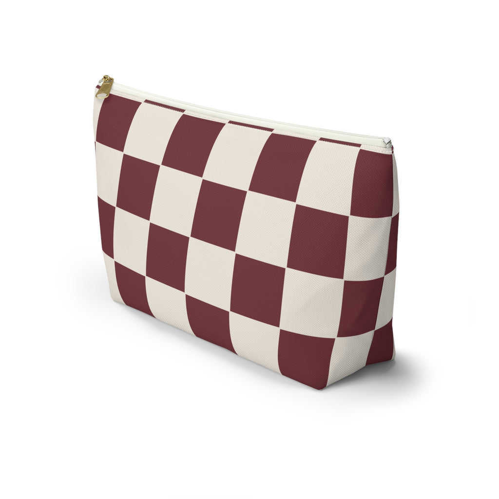 Side view of the burgundy cream checkered makeup bag